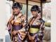 Two women in kimonos posing for a picture. 