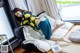 A woman laying on a bean bag chair in a room.